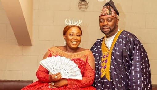 Segun Arinze with an actress in bridal costume